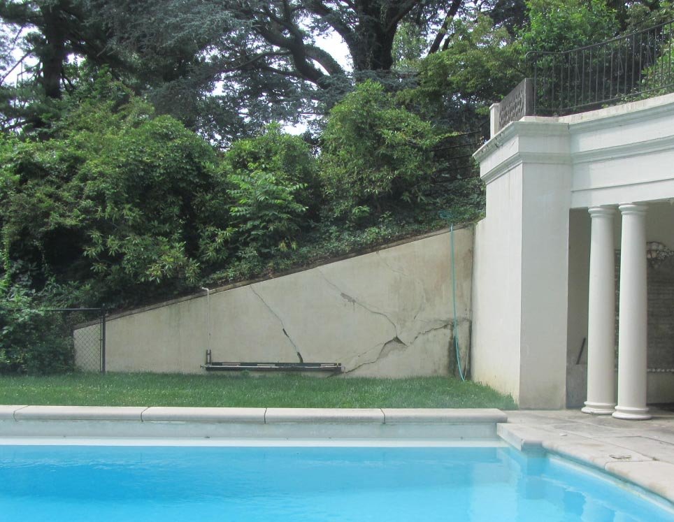 Grotto - concrete retaining walls damaged by poor drainage and tree roots