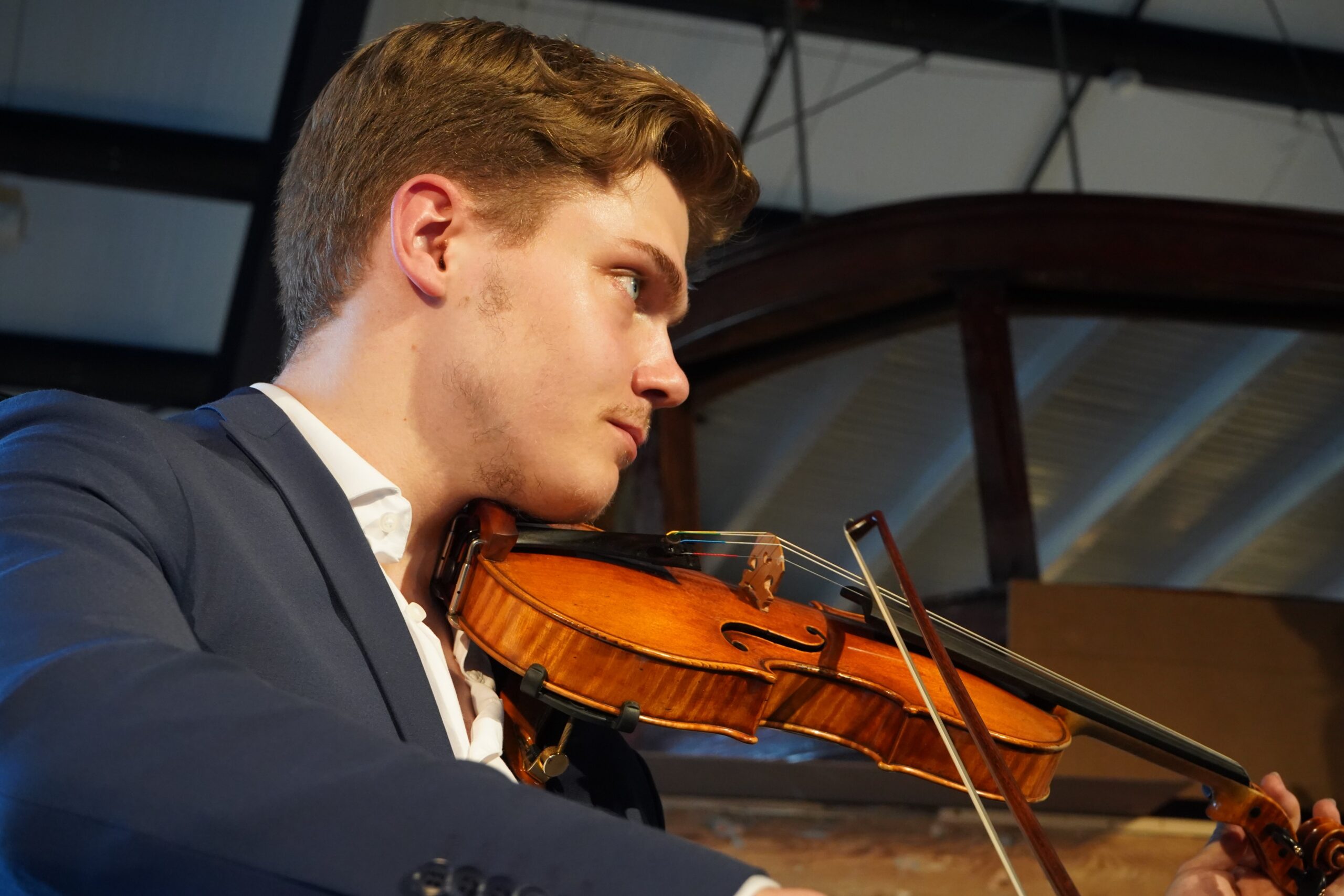 Young man playing a violin